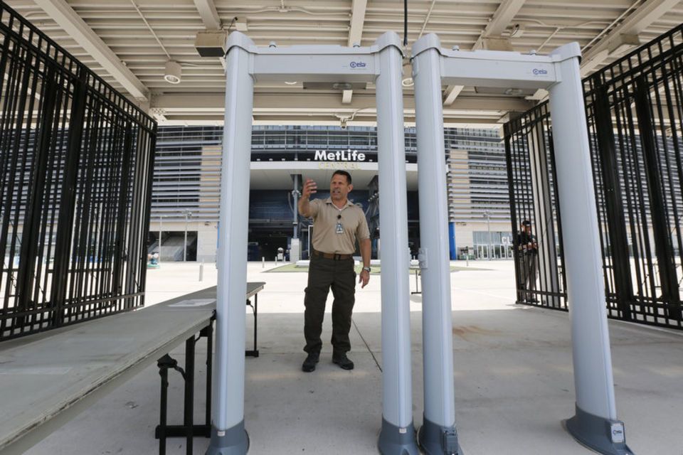 Fans go through metal detectors at Yankee Stadium