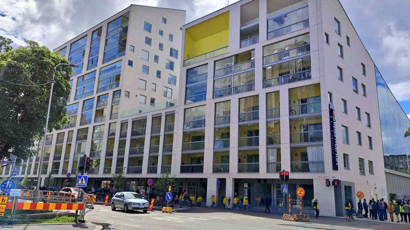 Thanks to the narrow ends and the two-level stands on the sides, the designers found space for residential buildings. Pictured is the north-east corner of the stadium.