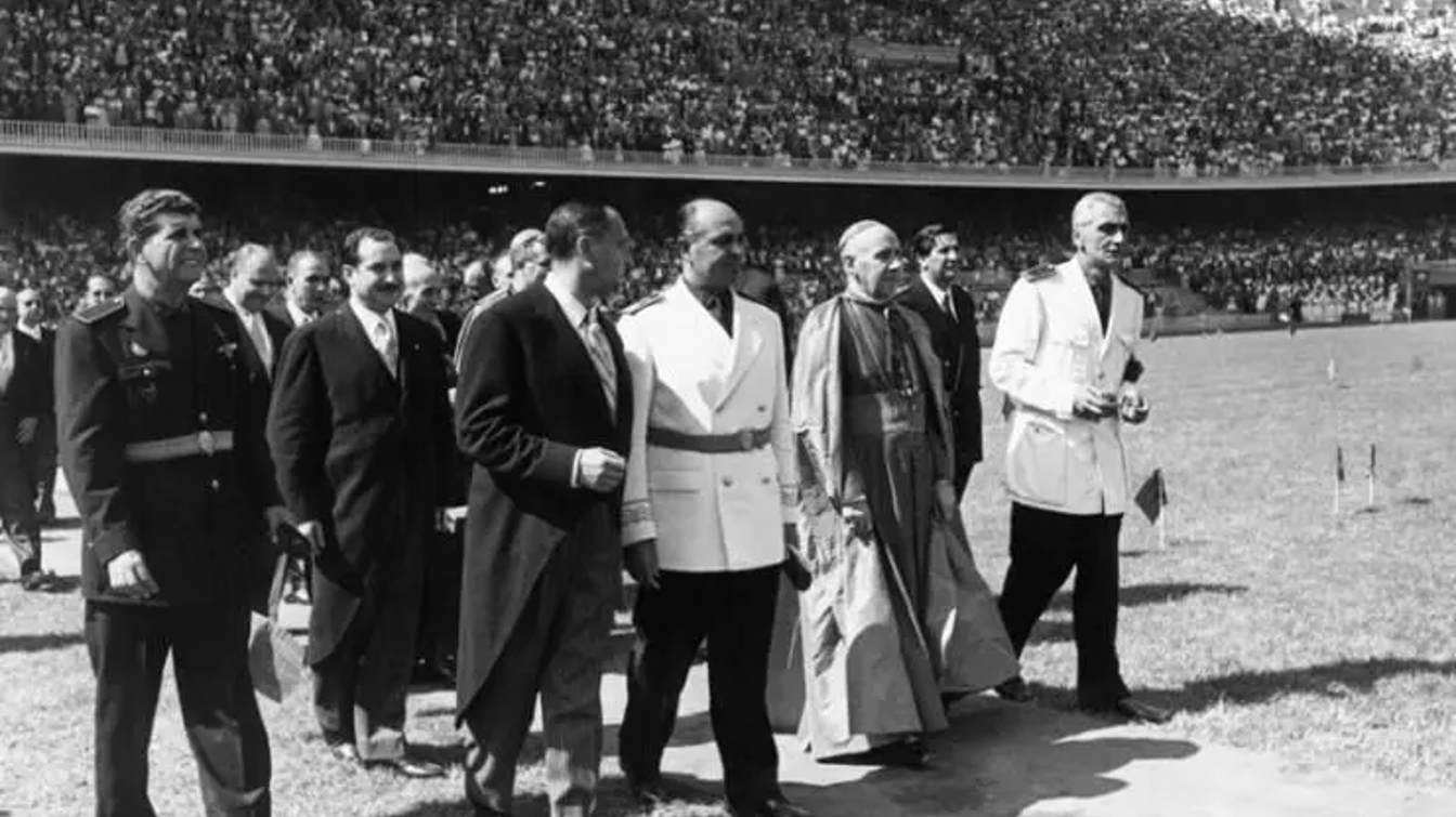 Government, club and church officials on the Camp Nou pitch during the inauguration of the stadium.