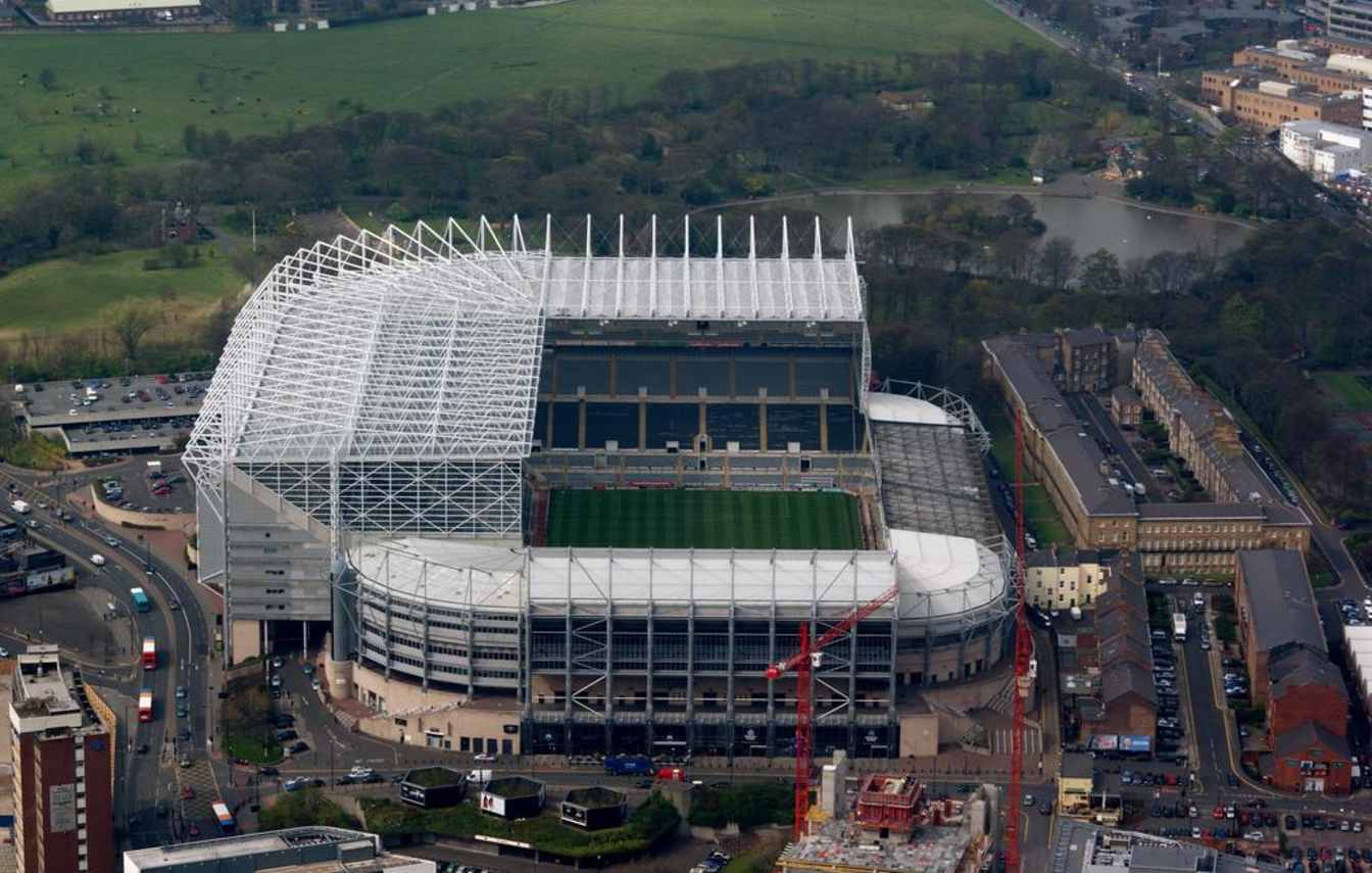 The proposed new stadium for Newcastle United F.C. could resemble Allianz Arena with its glowing exterior shell and modern design, although expansion plans for St James' Park remain under consideration.