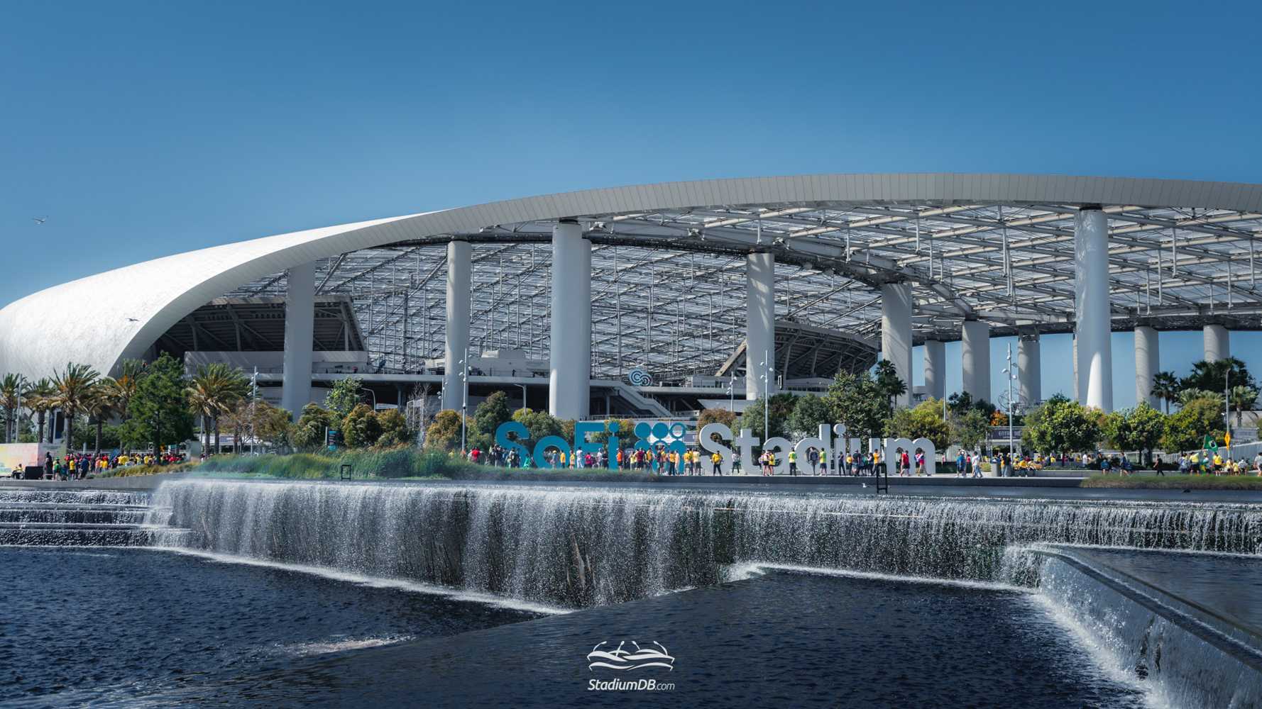 Workers at SoFi Stadium secured improved wages and stronger employment protections, avoiding a strike ahead of the 2026 World Cup. The talks also highlighted concerns over immigration-related security procedures.